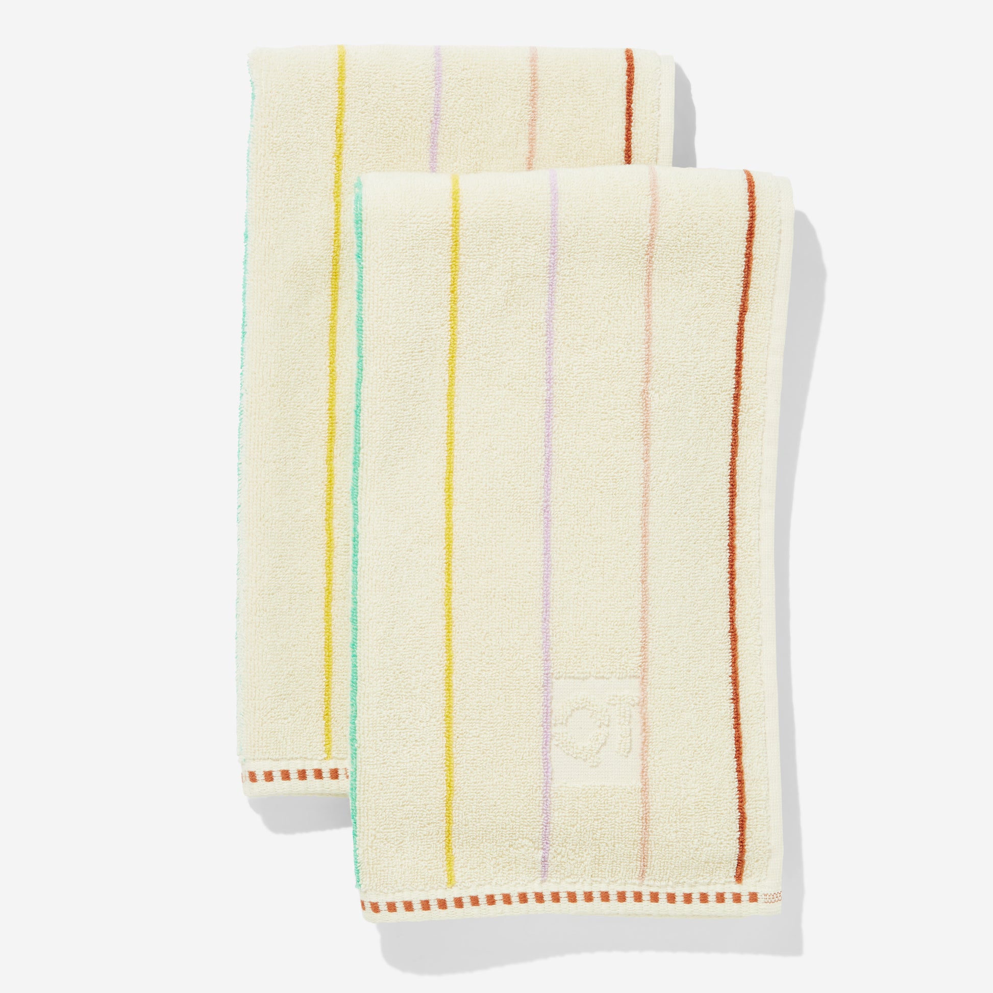 Set of two hand towels with multi-color horizontal pin stripes. Stripes are green yellow, lavender, rose, and clay.