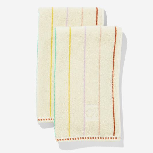 Set of two hand towels with multi-color horizontal pin stripes. Stripes are green yellow, lavender, rose, and clay.