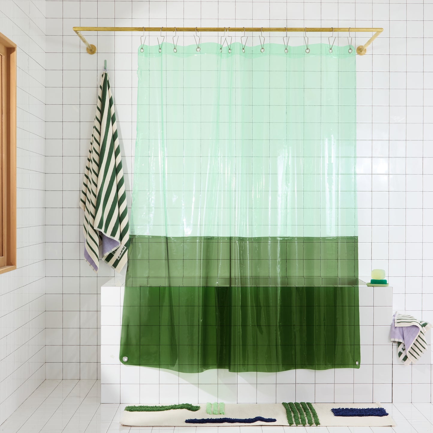 Sun Shower Orient Grass front view of curtain hanging in a bathroom.