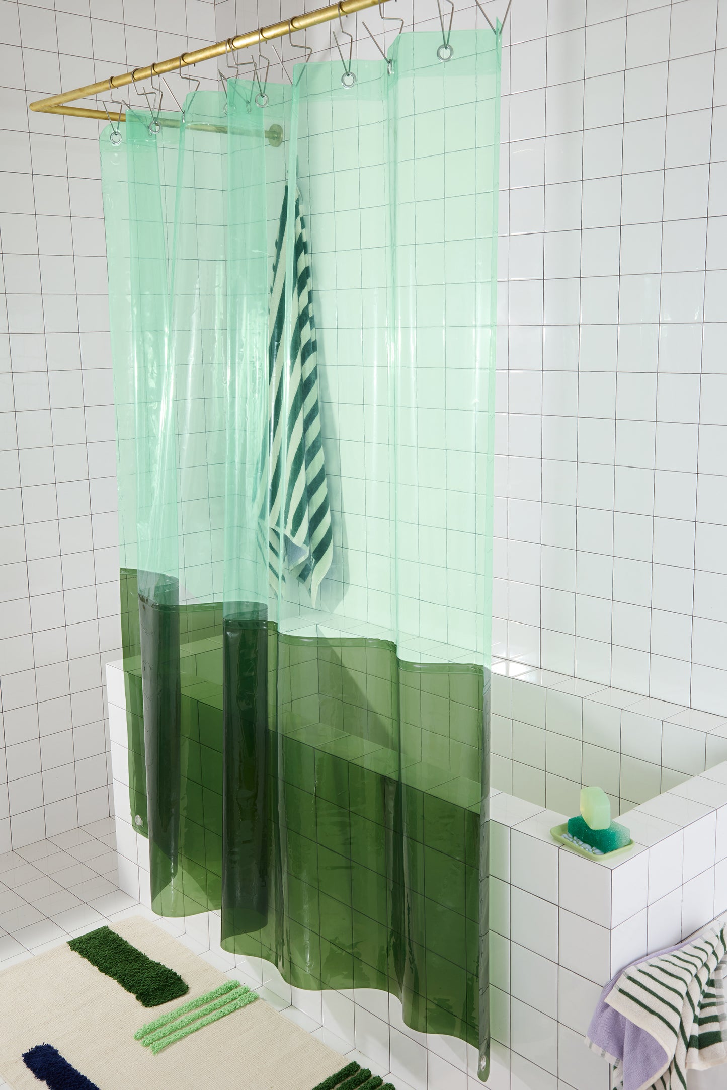 Sun Shower Orient Grass side view of curtain hanging in a bathroom.