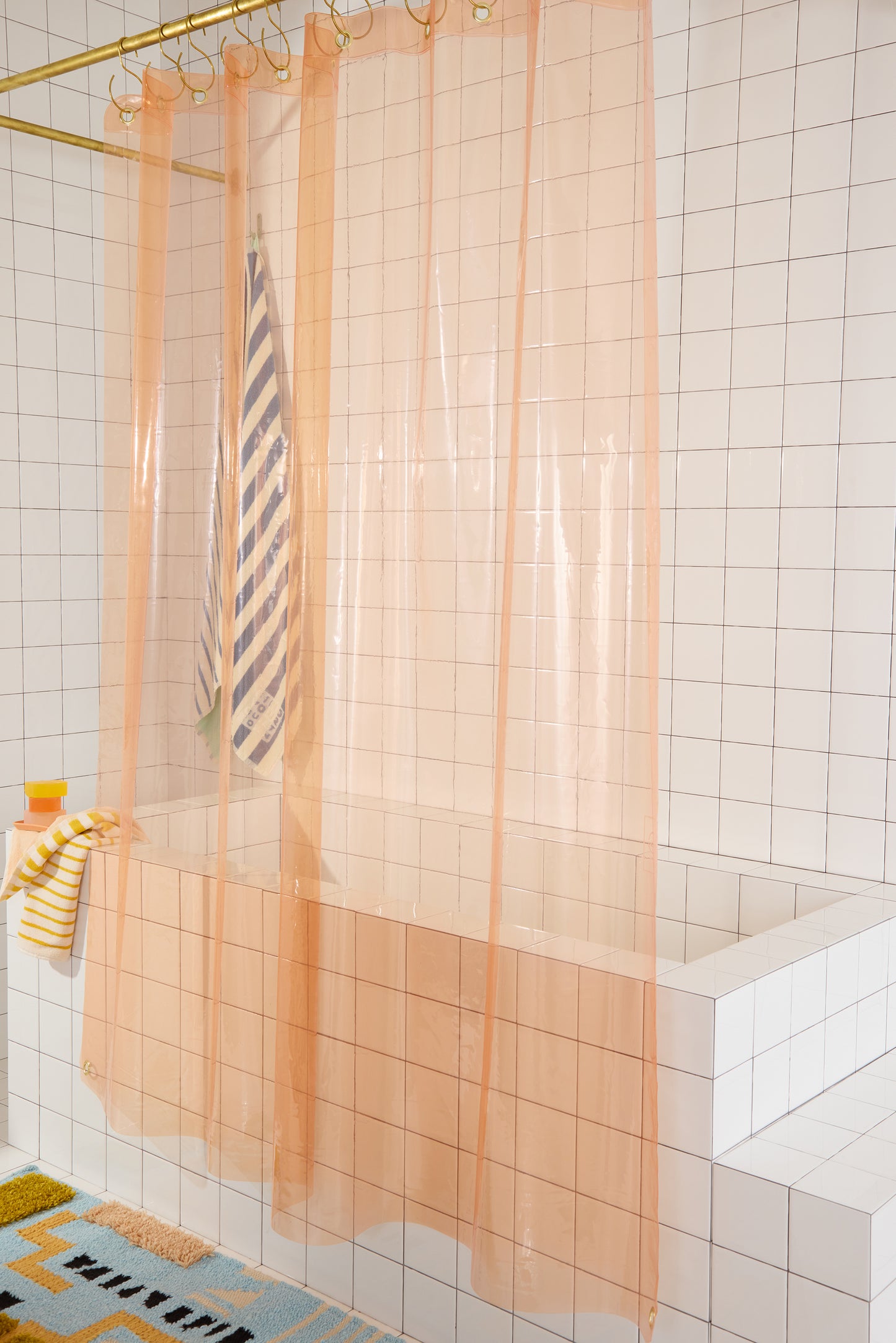 Sun Shower Cloud side view of curtain hanging in a bathroom.