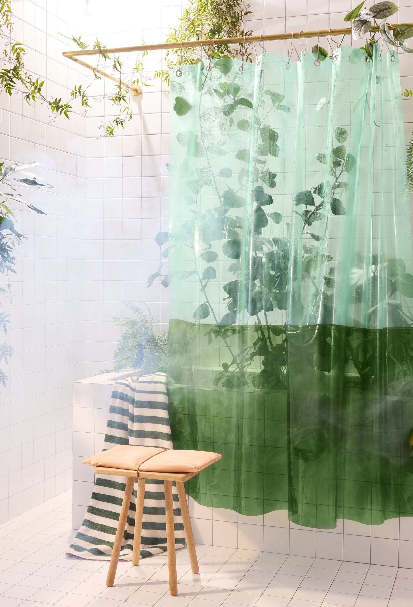 Sun Shower Orient Grass front view of curtain hanging in a bathroom with ornamental plants