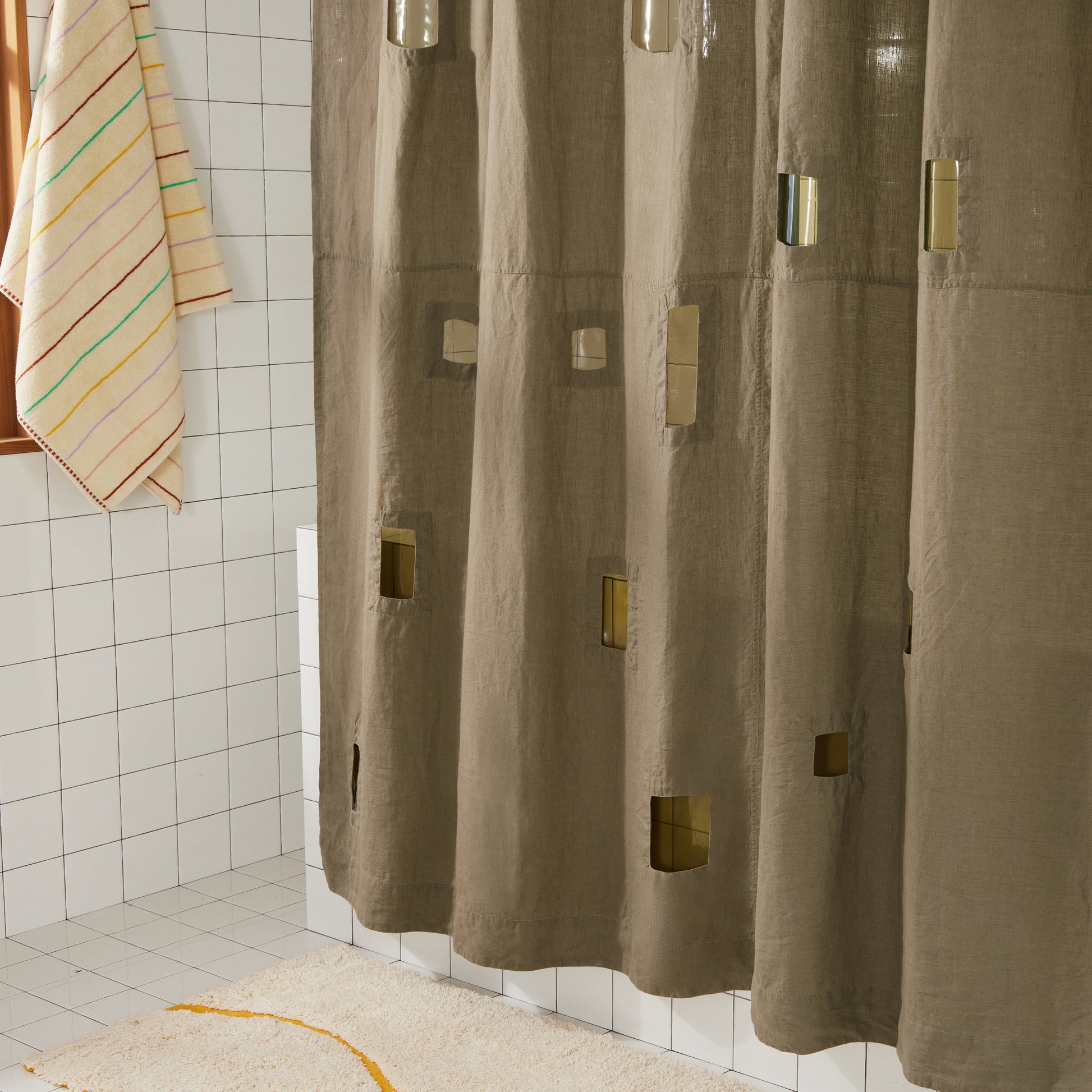 Bottom left corner of Ronchamp curtain in olive, showing transparent cutouts where light shines through.