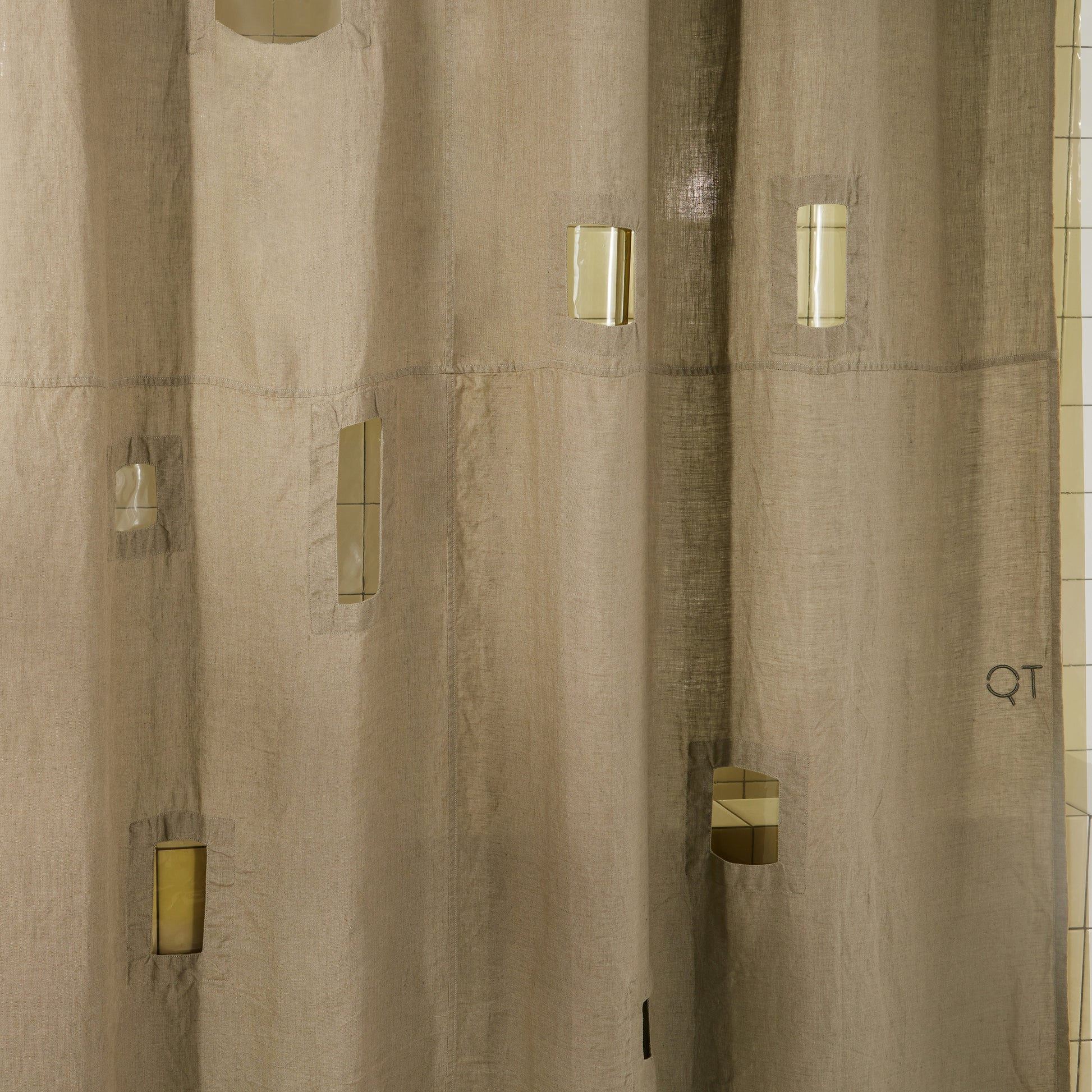 Detail view of ronchamp linen curtain in olive.