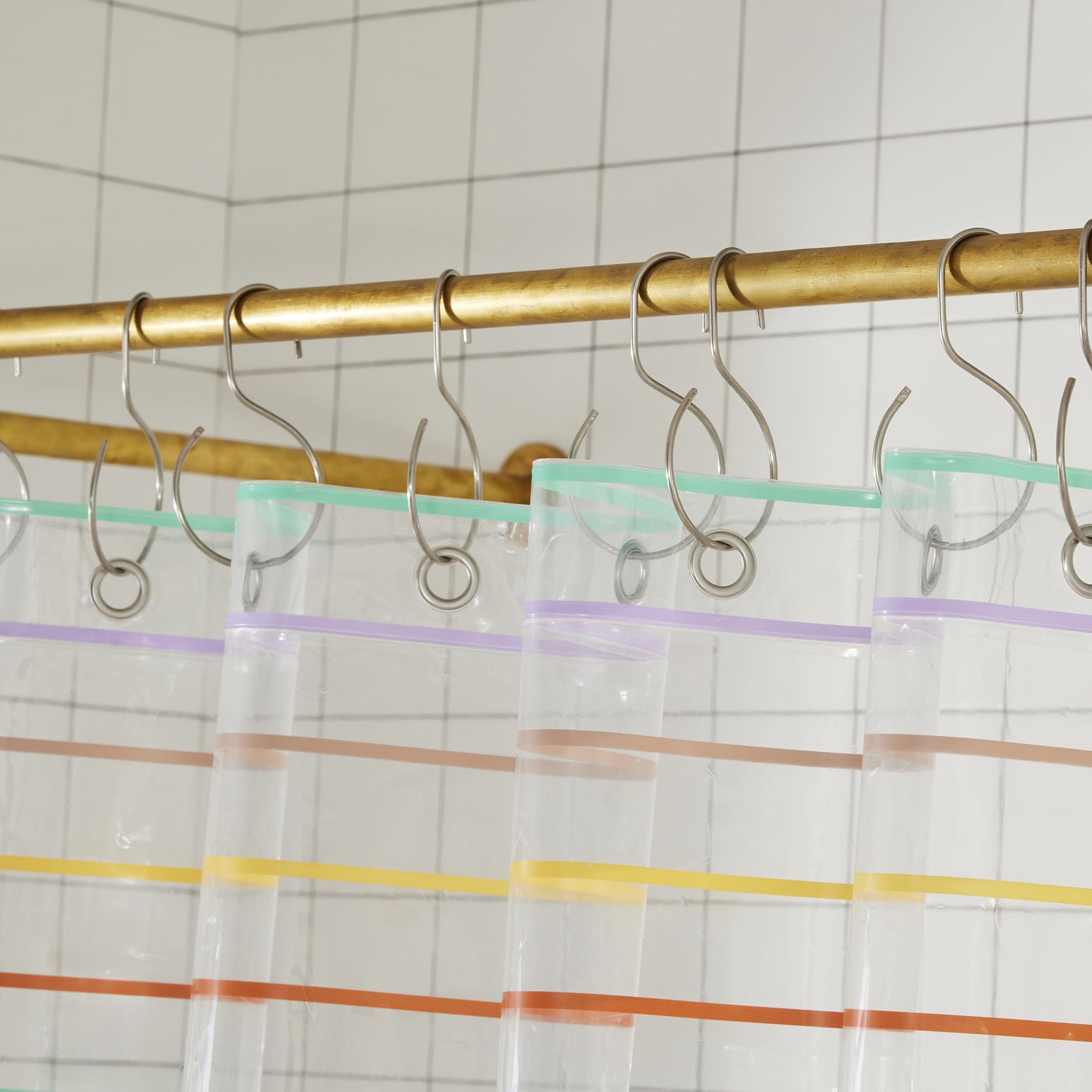Top hem of Shower curtain featuring small nickel-plated grommets and stainless steel S Hooks.