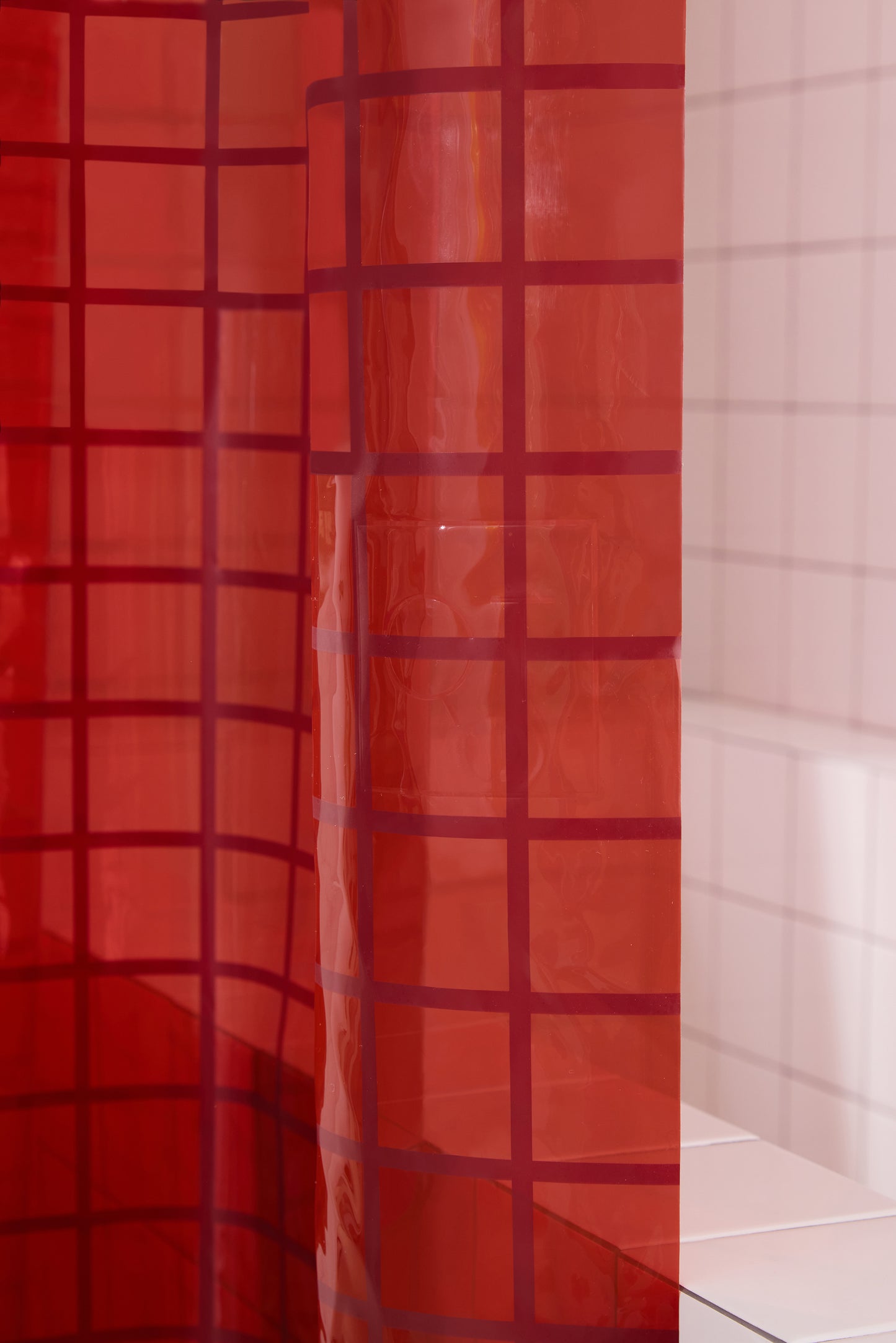 Close up detail of 2x2 grid sun shower curtain in brick.
