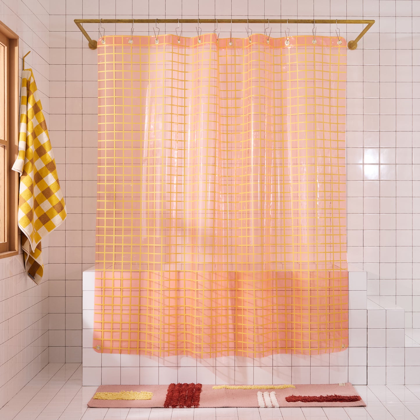Peony 2x2 grid sun shower curtain styled in white tiled bathroom.