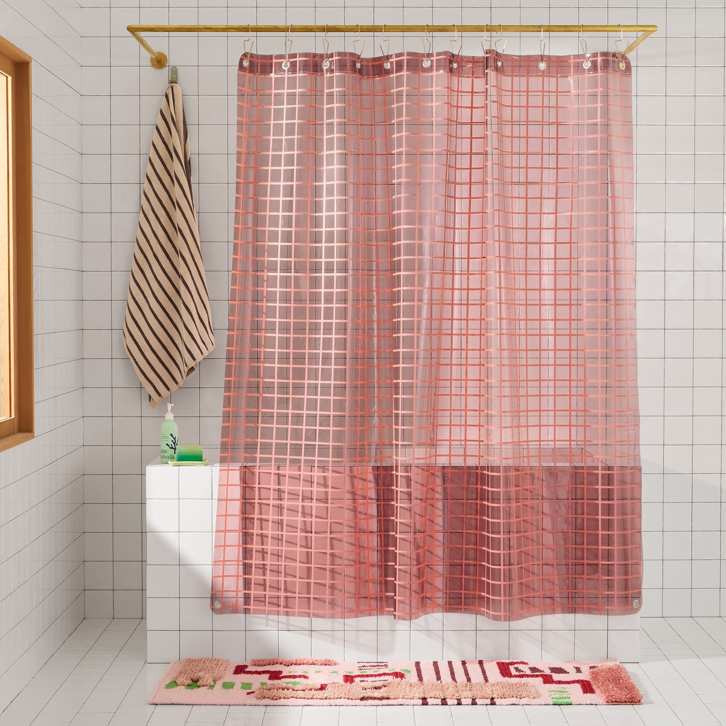 Sun Shower in Rose 2x2 front view of curtain hanging in a bathroom.