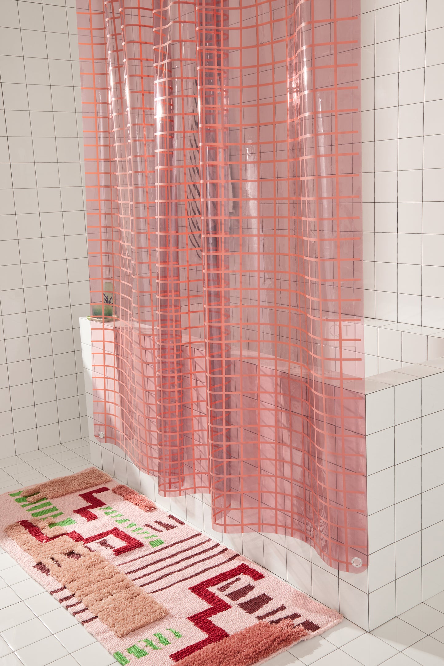 Sun Shower in rose 2x2 detail view of side of the curtain styled in white tiled bathroom.