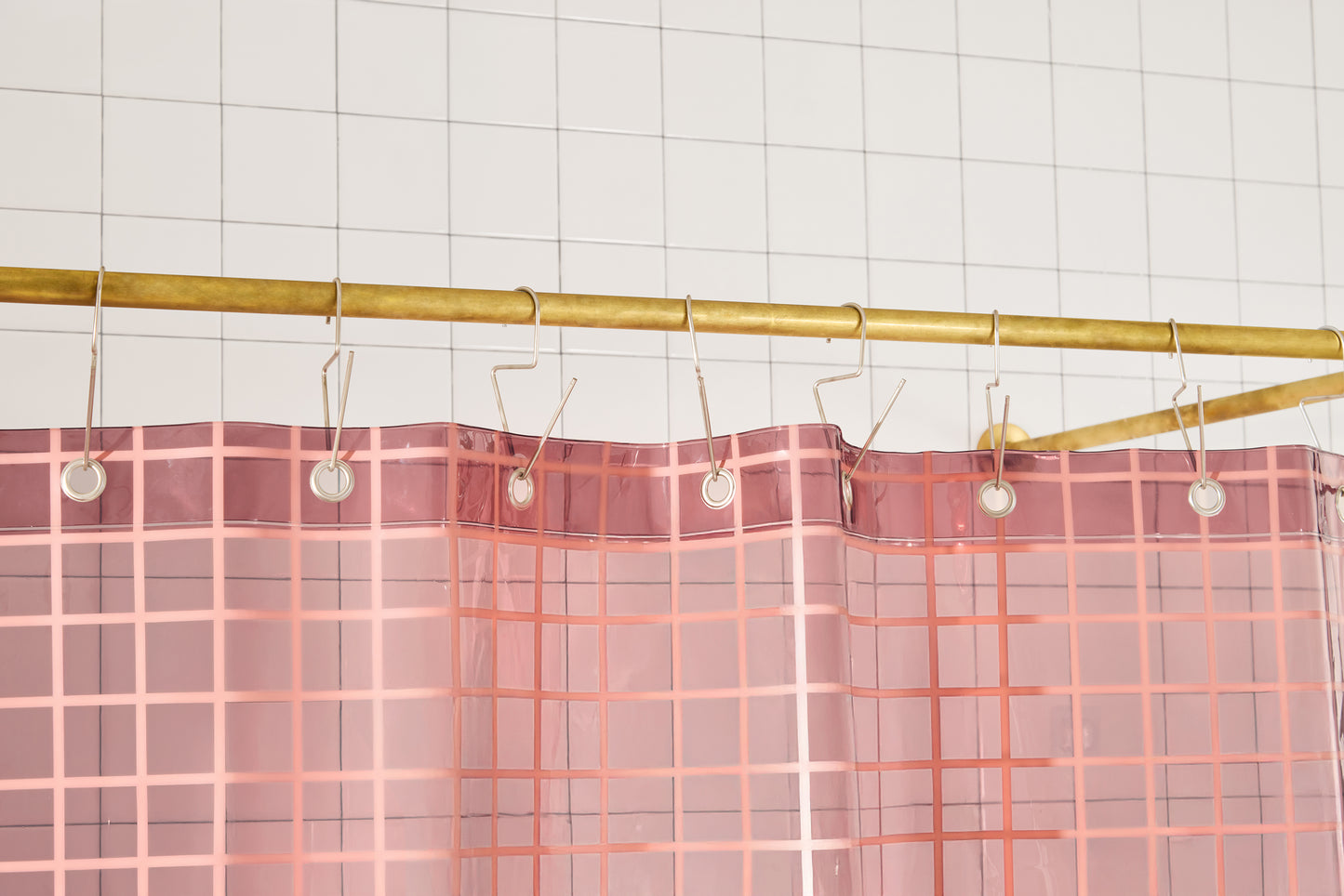 Sun Shower in Rose 2x2 detailed view of top seam hanging from a brass rod from silver venice hooks.