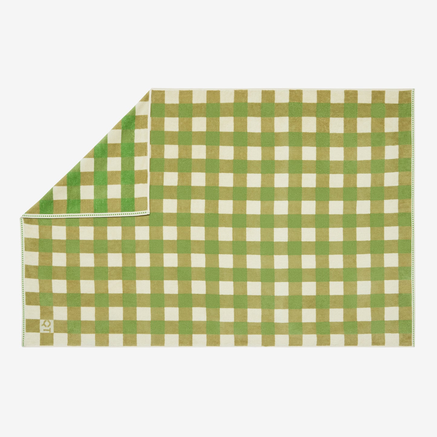 Green and white checkered towel on a light gray background