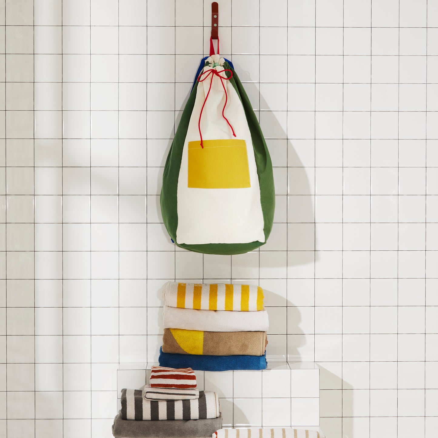 Re:Canvas Laundry Bag Pine Hanging on bathroom wall