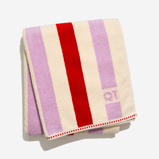 Catalina bath sheet in cherry folded against white background.