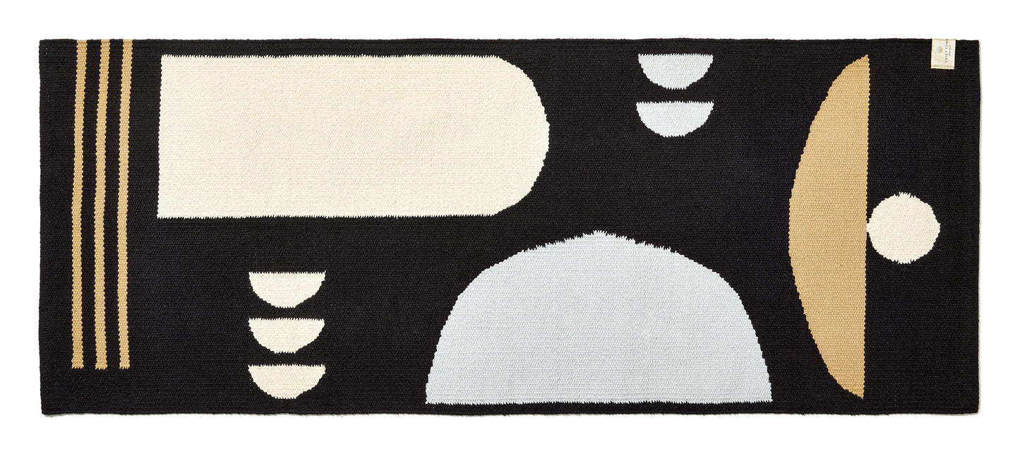 black and grey and cream colored runner bath rug