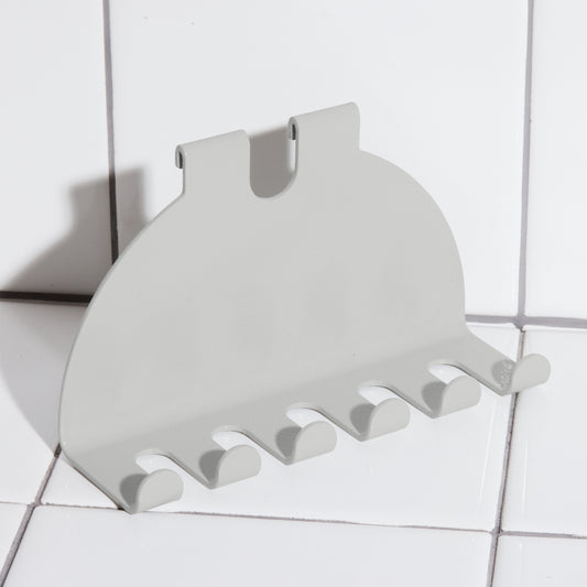 Aluminum toothbrush holder hook in driftwood.