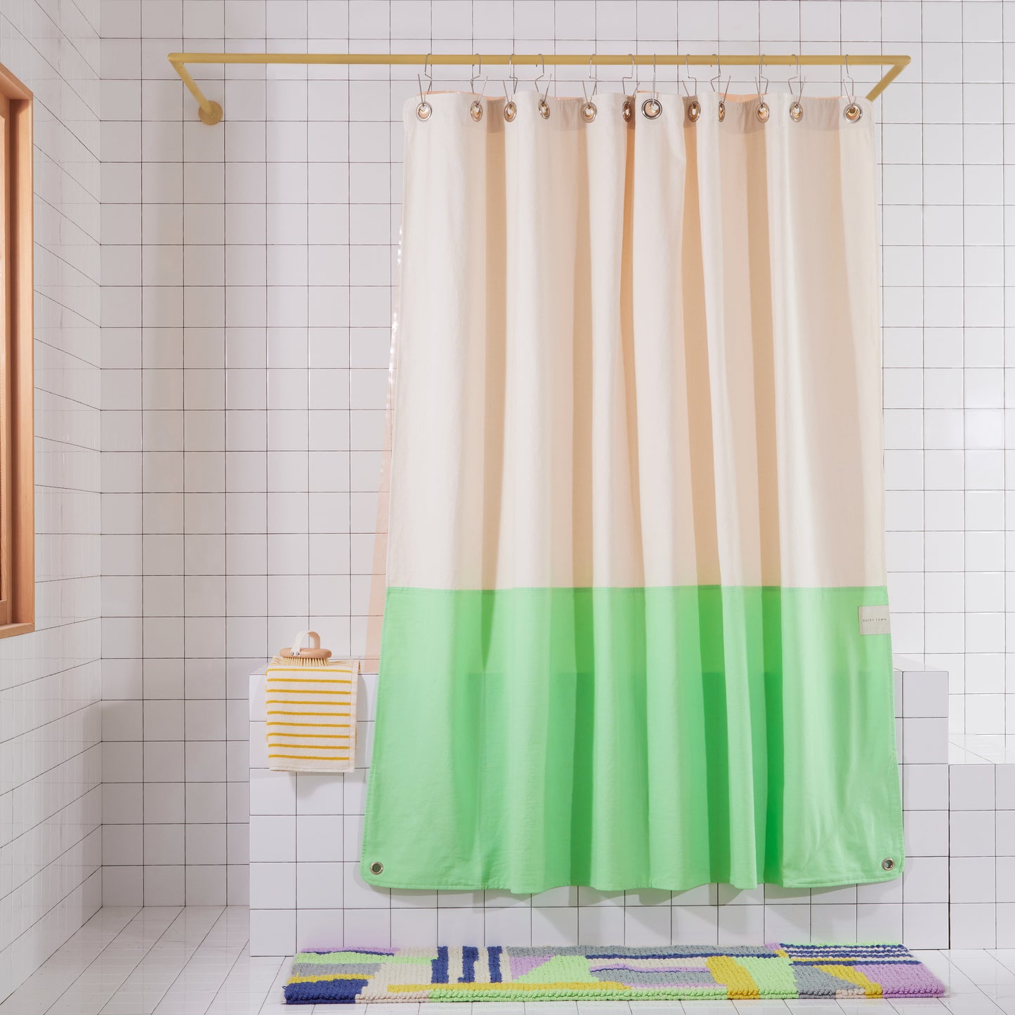Orient Blush front view of curtain hanging in a bathroom.