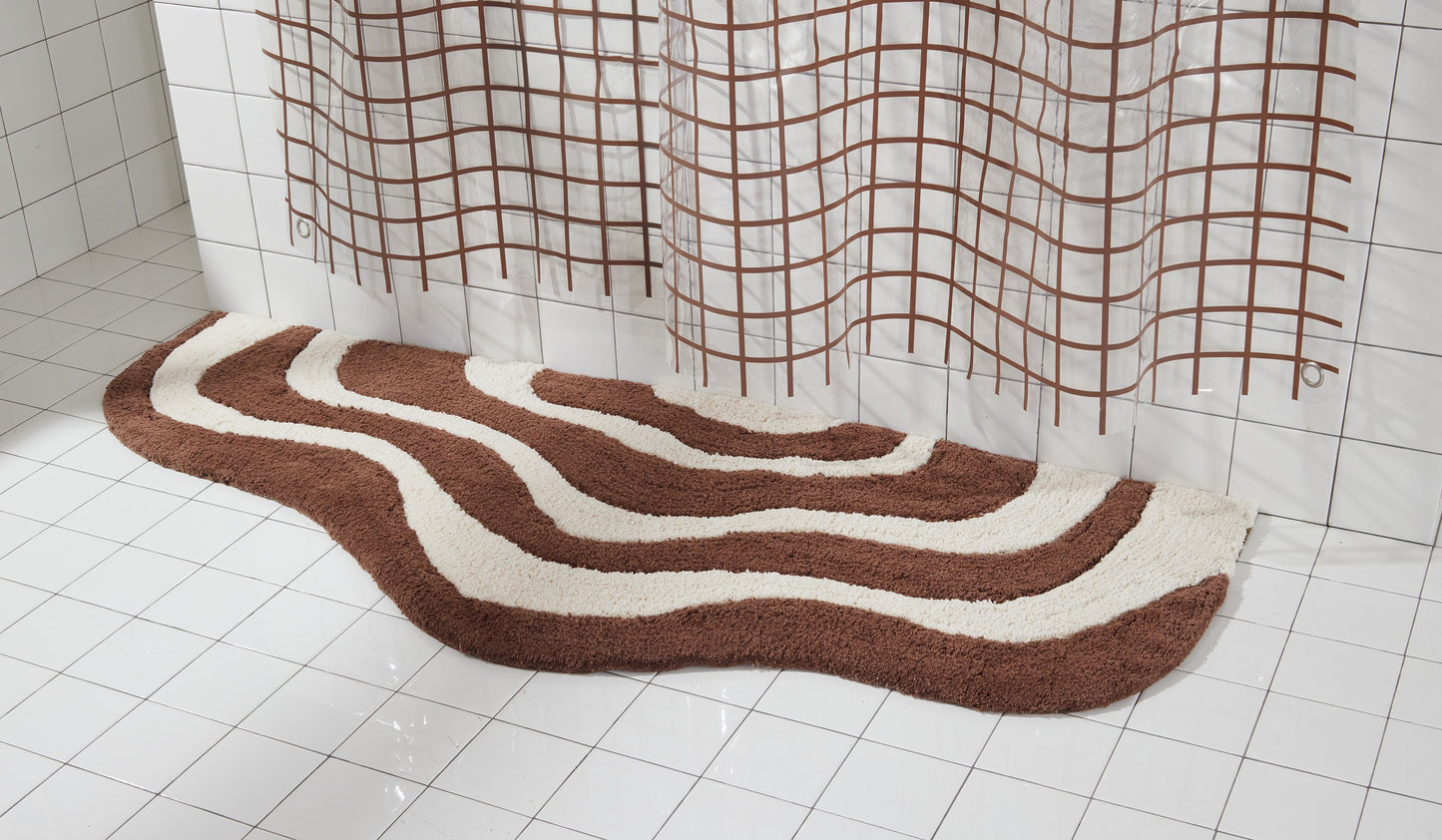 56"x22" lost coast runner in chocolate styled next to white tiled bathtub.