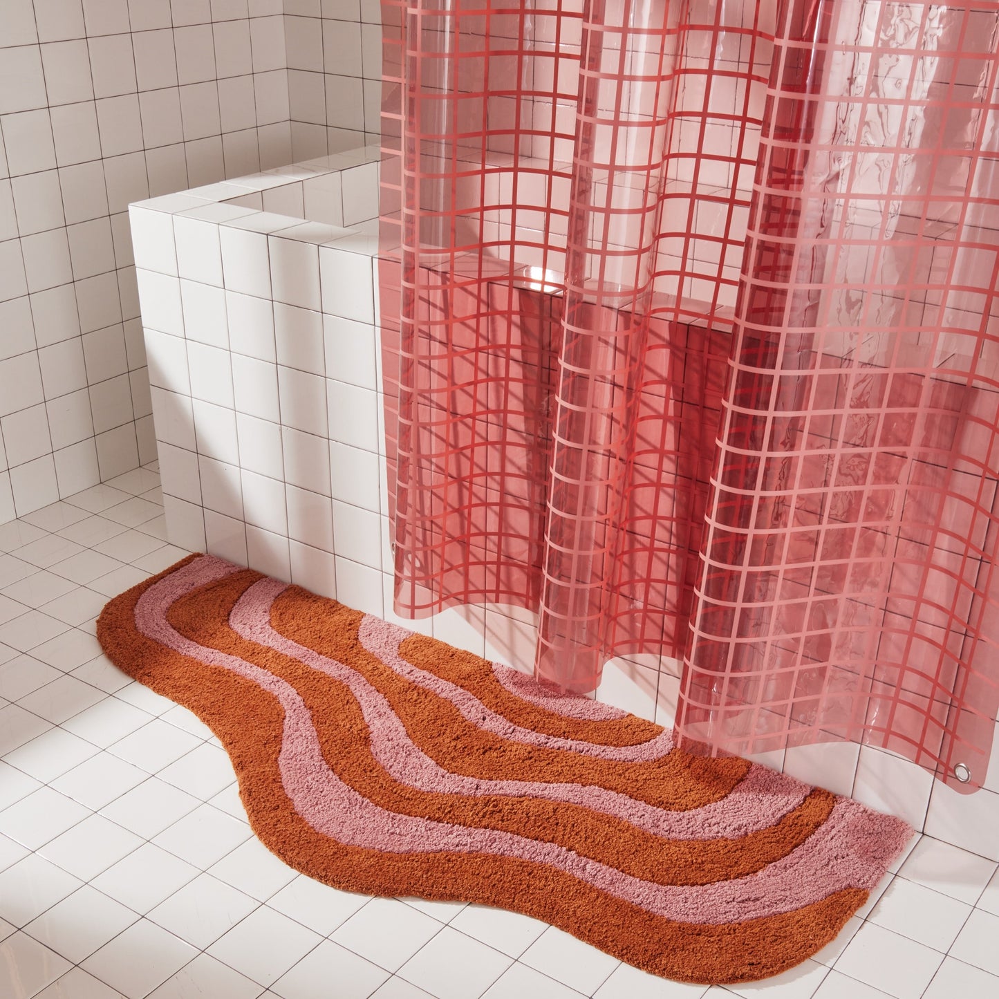 Lost coast bath mat runner in 56"x22" size styled with 2x2 sun shower curtain in rose.