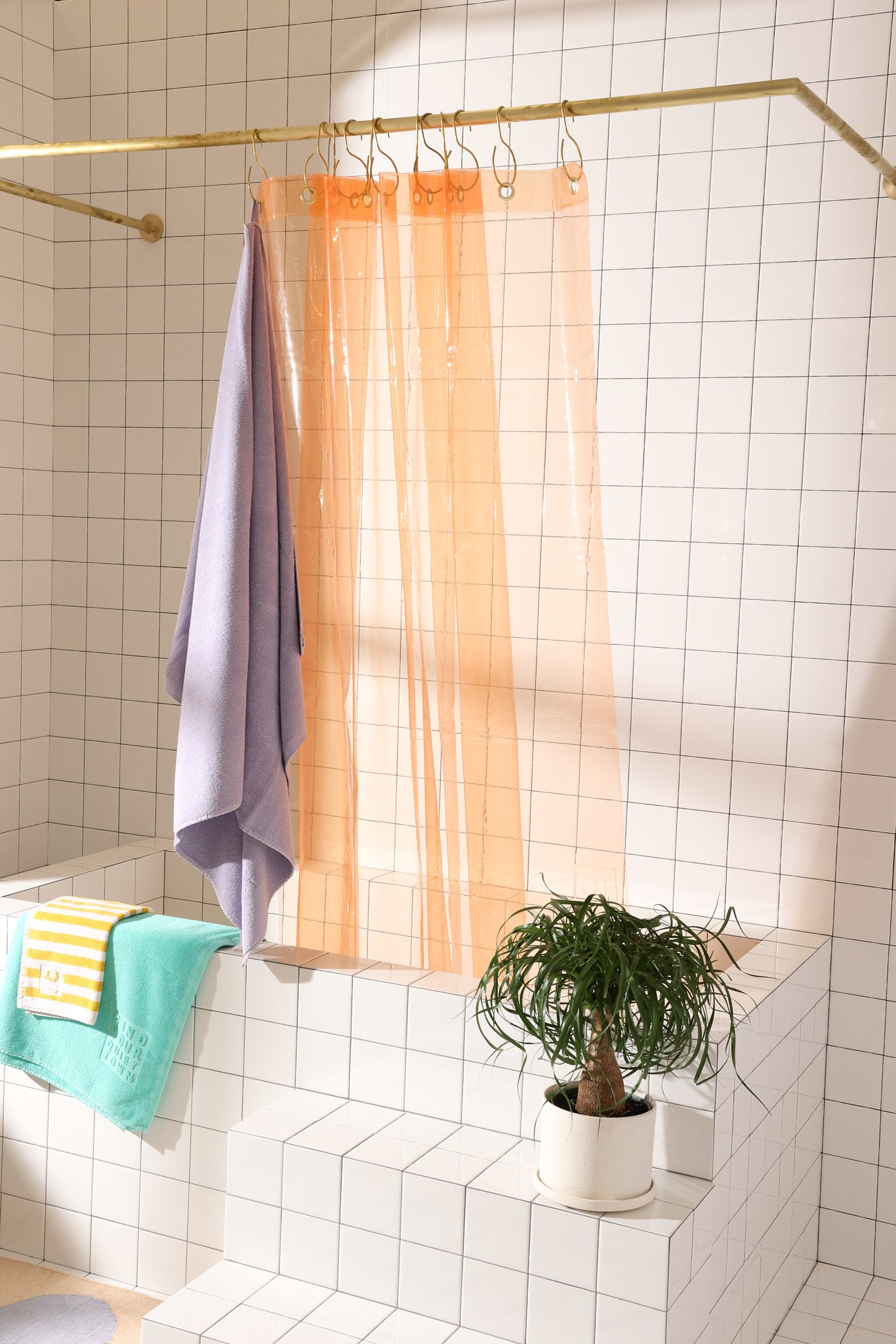 Sun Shower Cloud front view of curtain draped along inside edge of tub