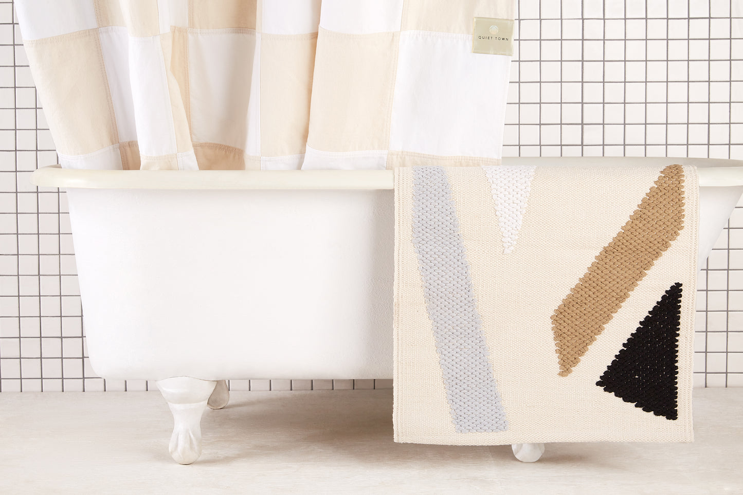Re:Canvas Checker Sand front view of curtain draped along inside edge of tub