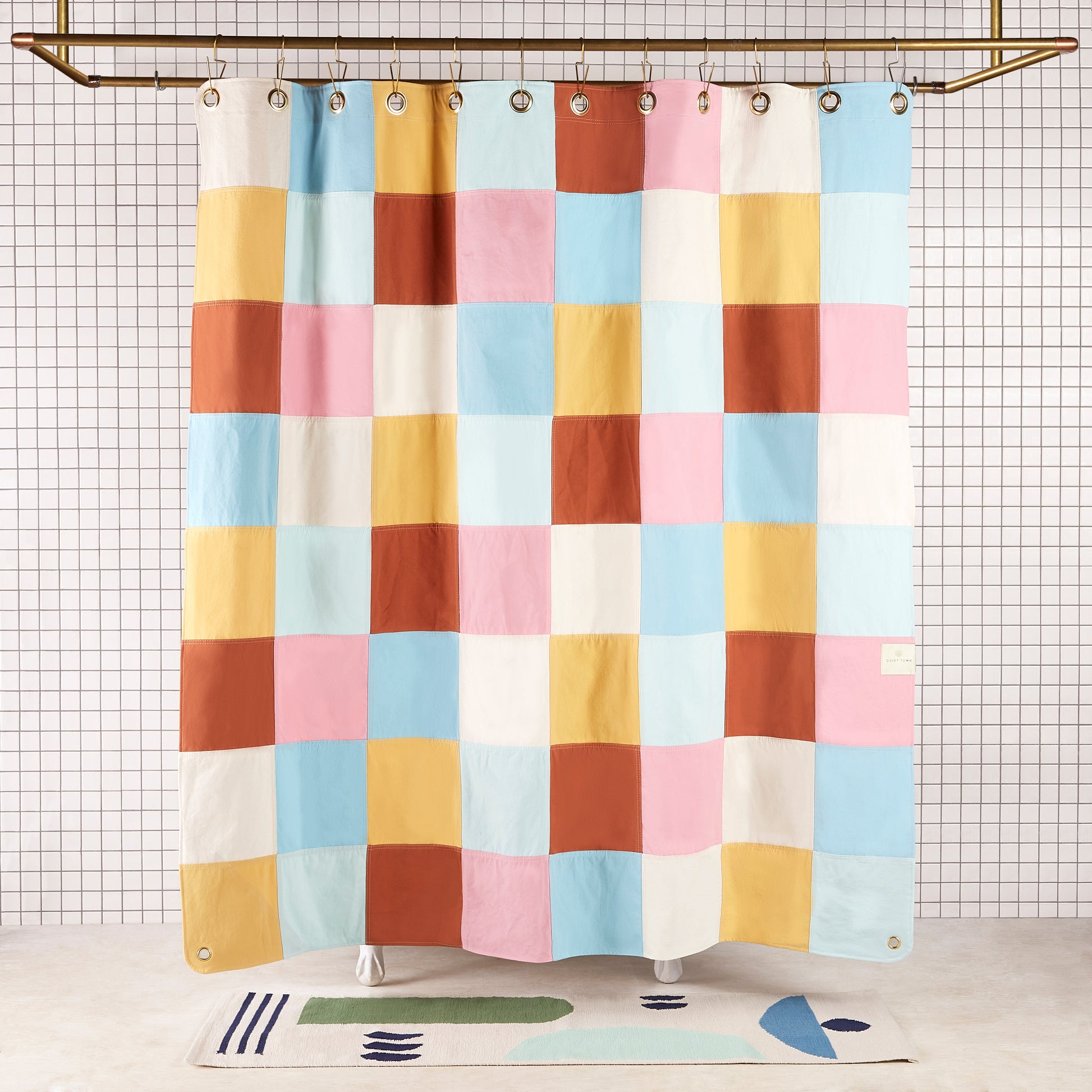 Re:Canvas Checker Deco front view of curtain hanging in a bathroom.