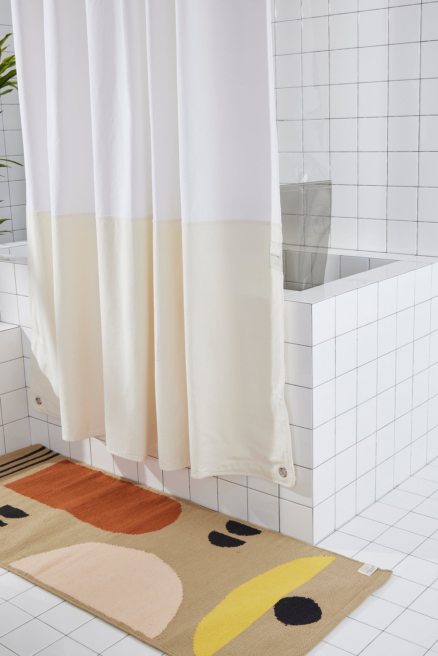 Orient Sand side view of curtain hanging in a bathroom.