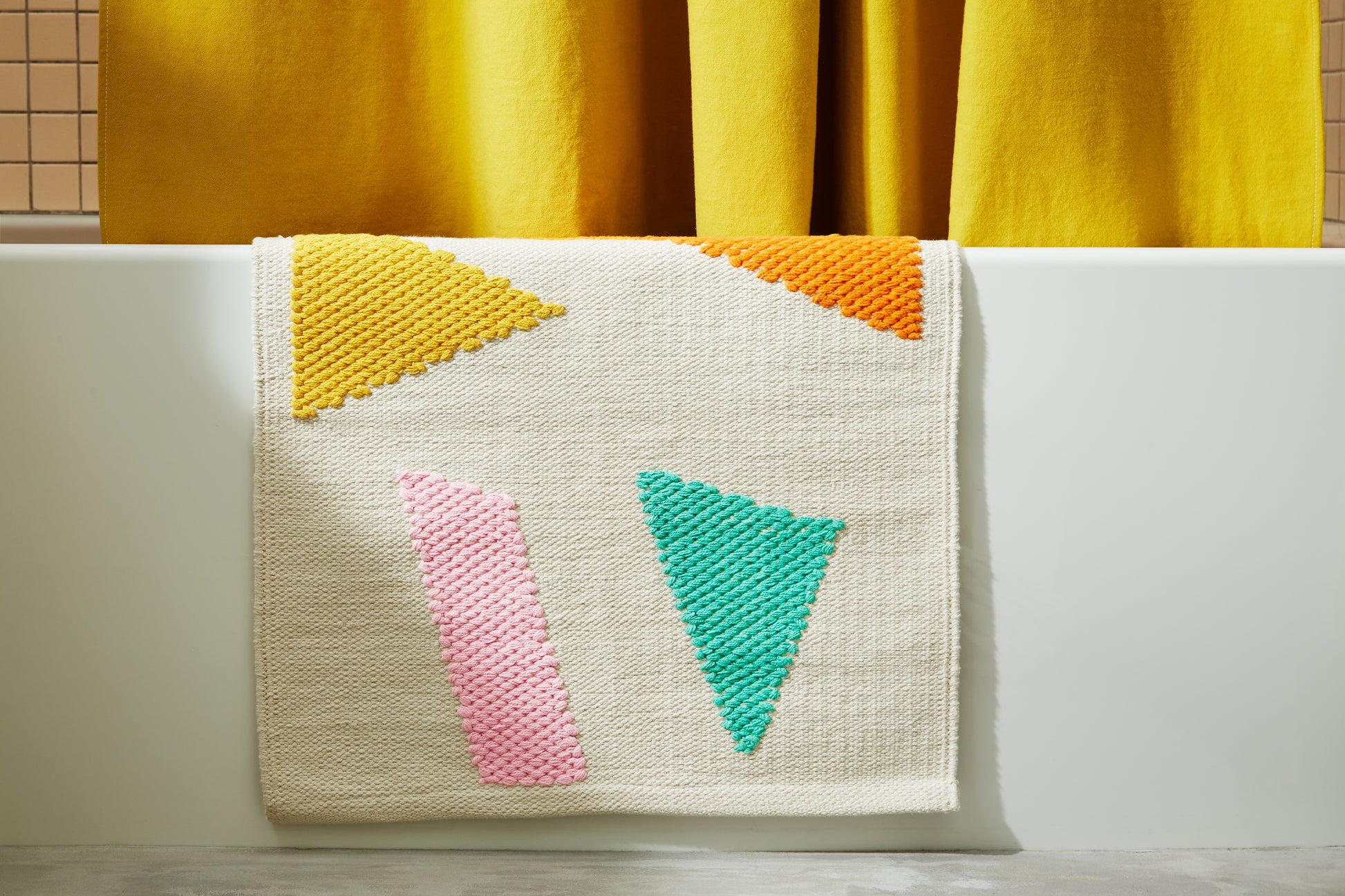 Ataco Canyon bath rug draped on edge of bath tub