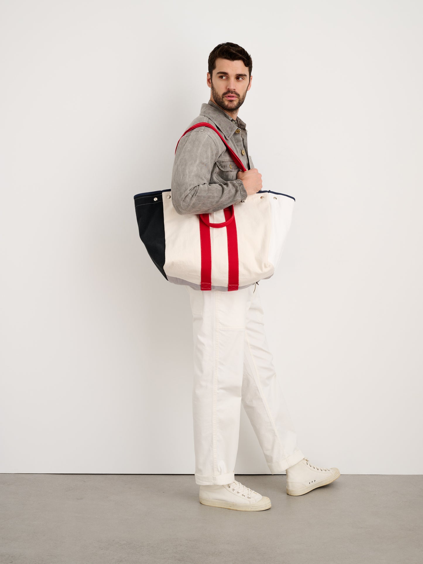 Alex Mill x Quiet Town Perfect Weekender Tote Pine front view carried on shoulder