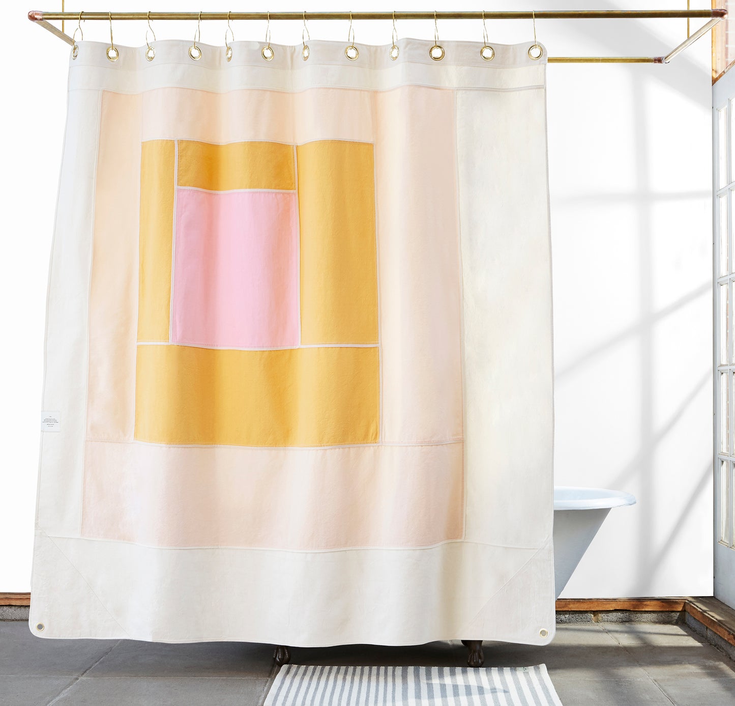 Marfa Cloud front view of curtain hanging in a bathroom.