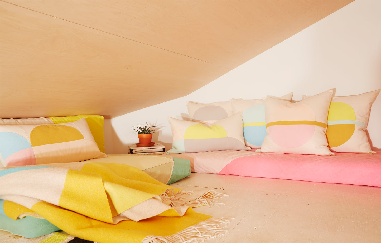 Re:Canvas Arco Canyon Lumbar Pillow placed in bedroom