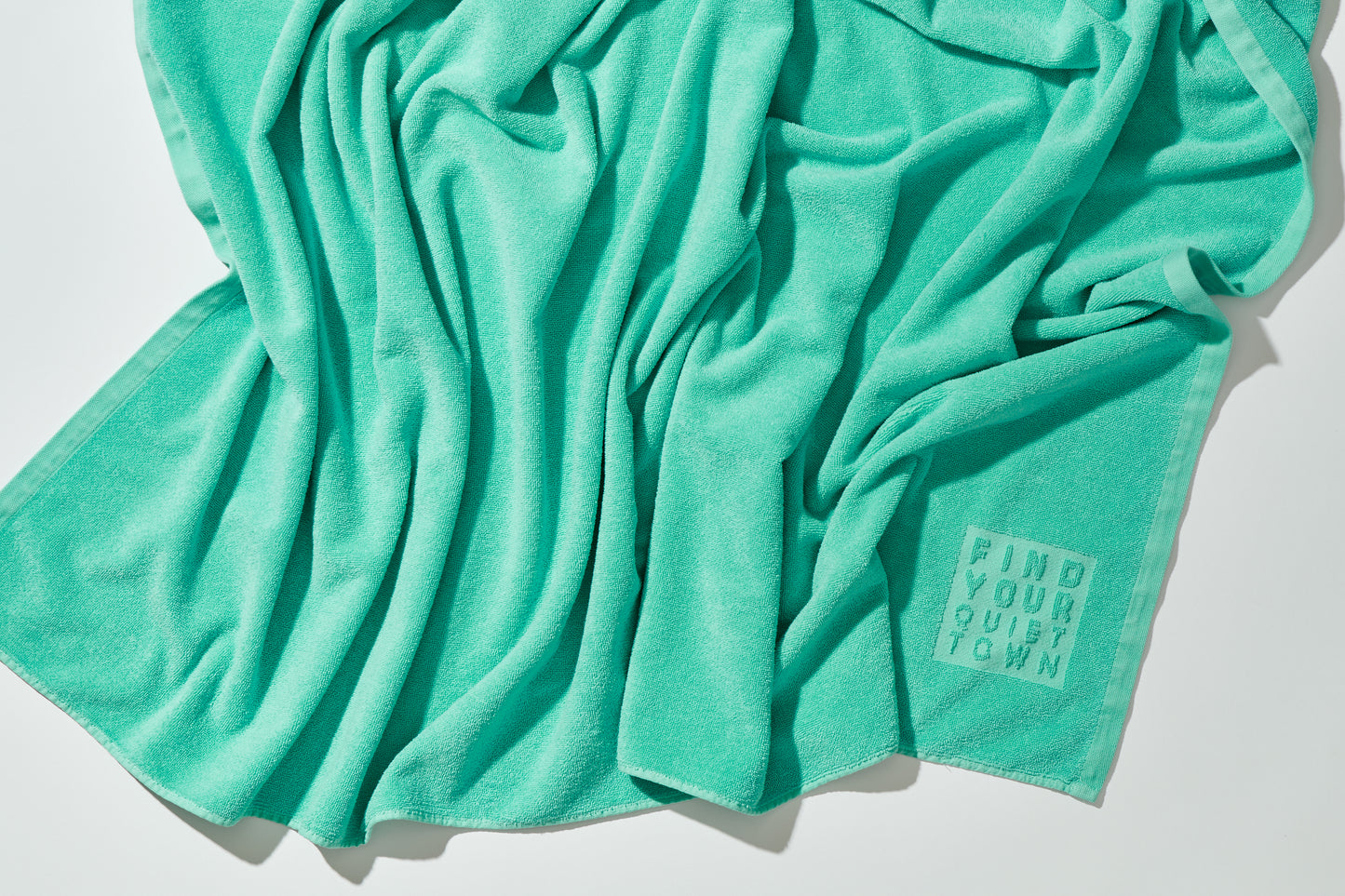 Quiet Towel Jade top shot crumpled on floor