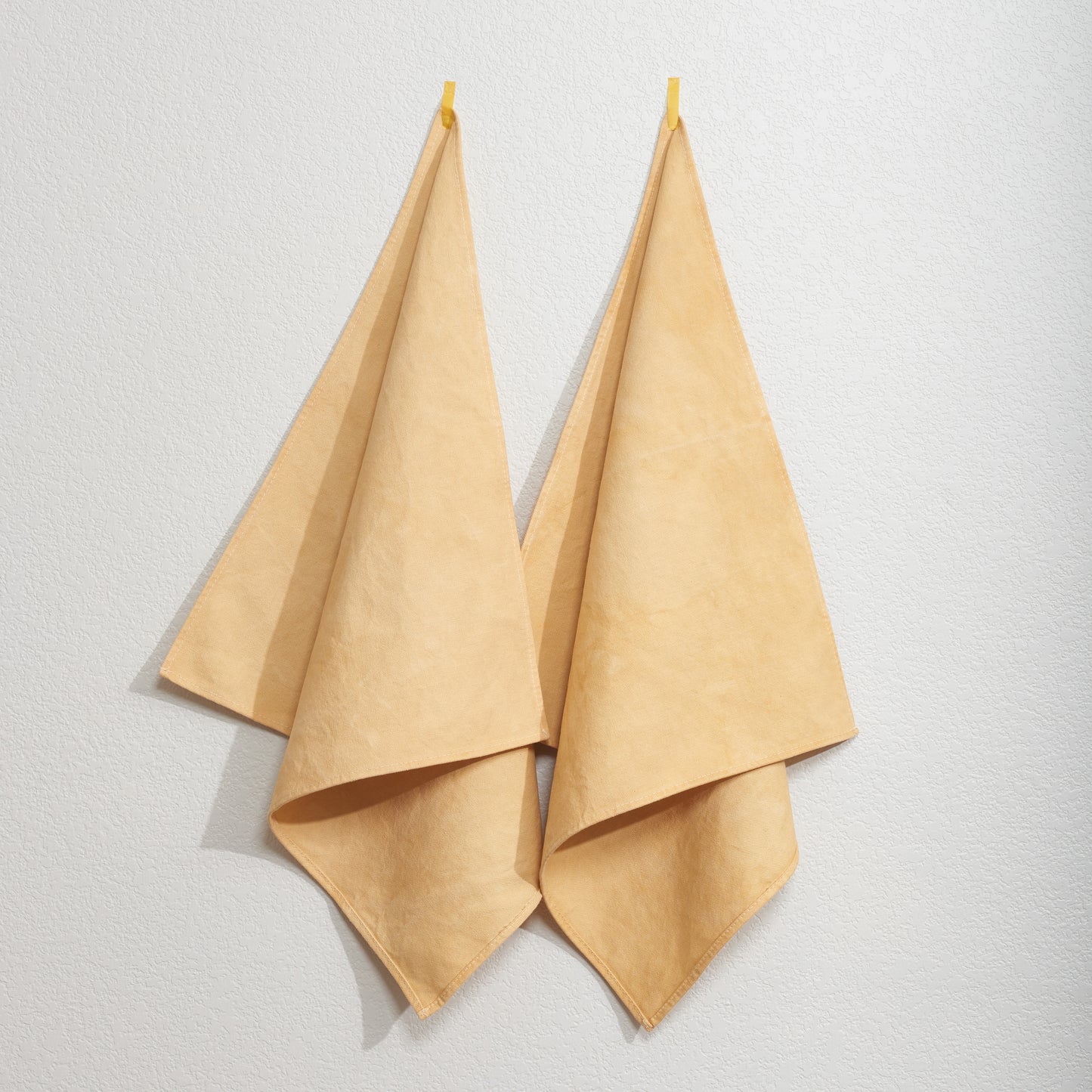 Naturally Dyed Napkins in Eucalyptus hanging on wall
