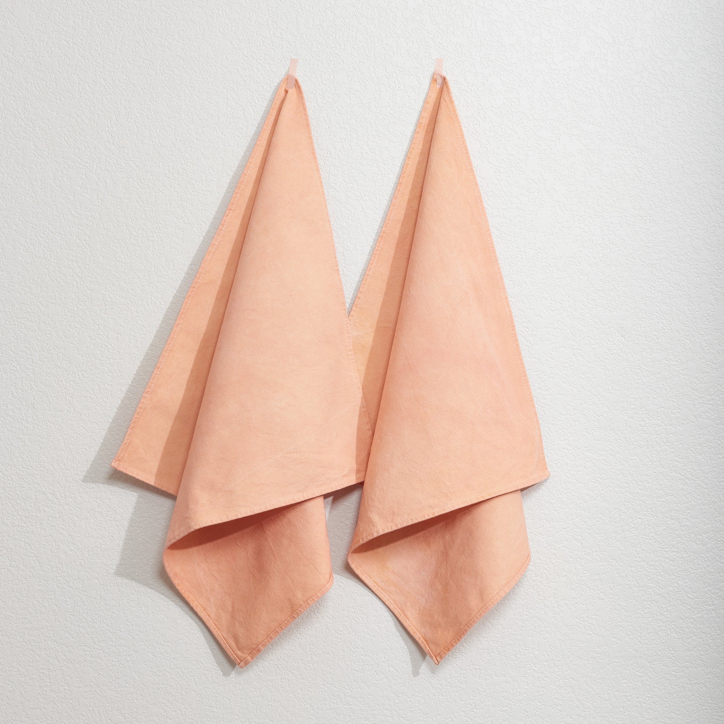 Naturally Dyed Napkins in Madder Root hanging on wall