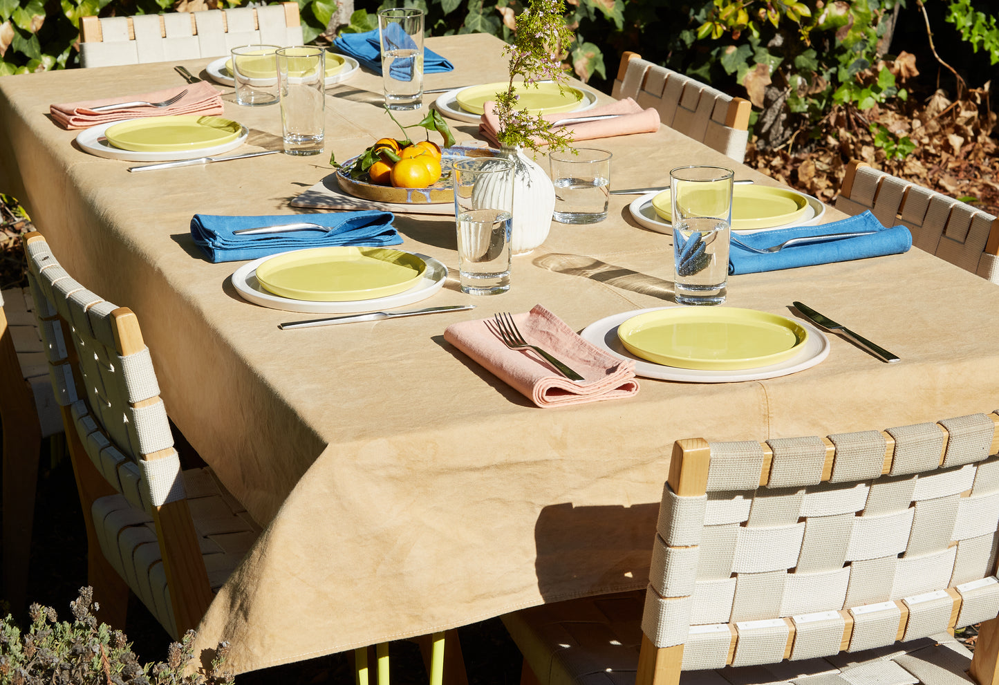 Naturally Dyed Tablecloth for 8 in Eucalyptus detail view in outdoor dining