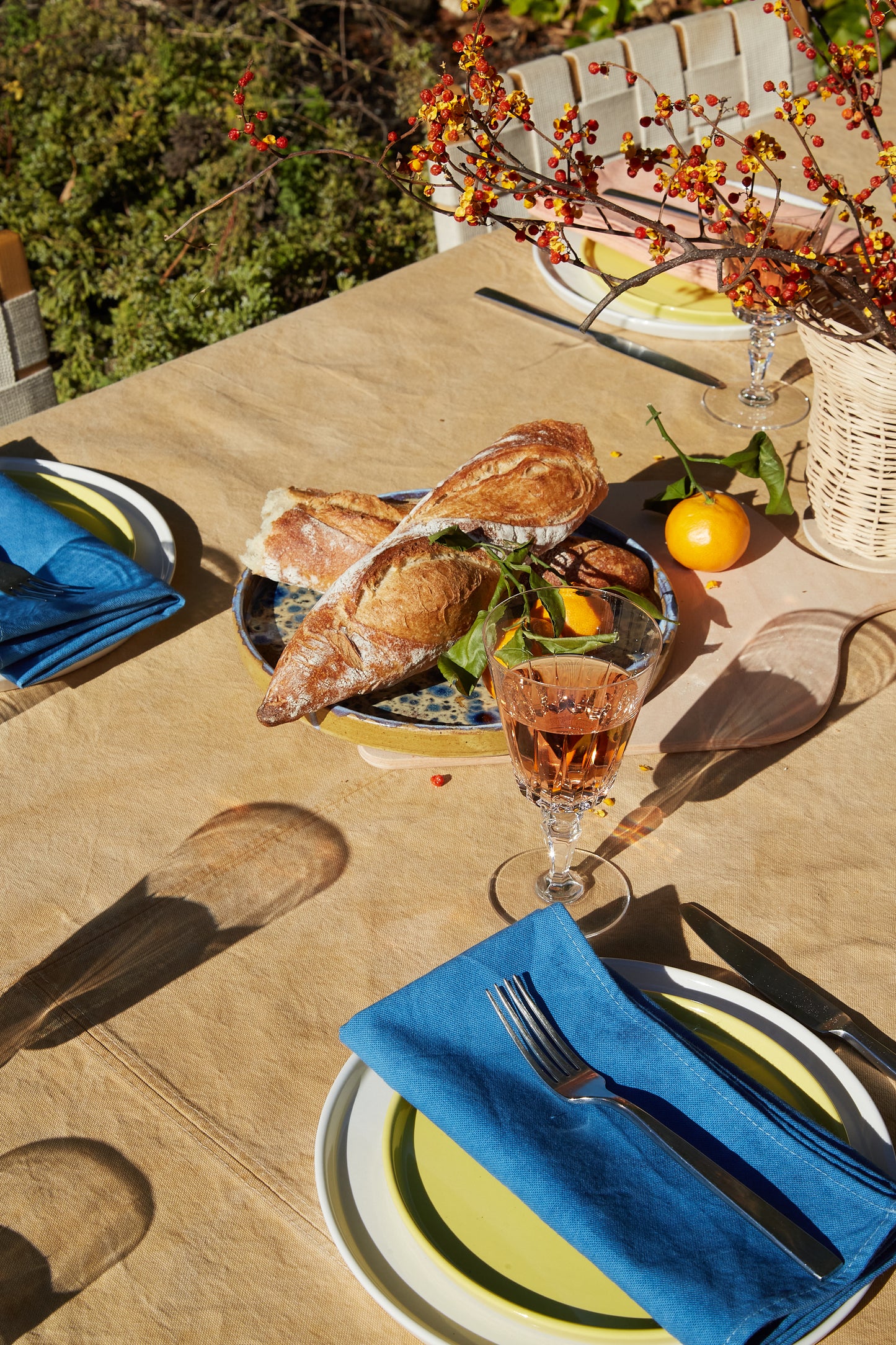 Naturally Dyed Tablecloth for 4 in Eucalyptus detail view with table arrangement
