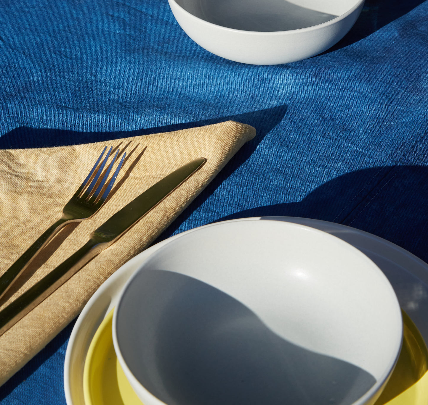 Naturally Dyed Tablecloth for 4 in Indigo detail view with tableware