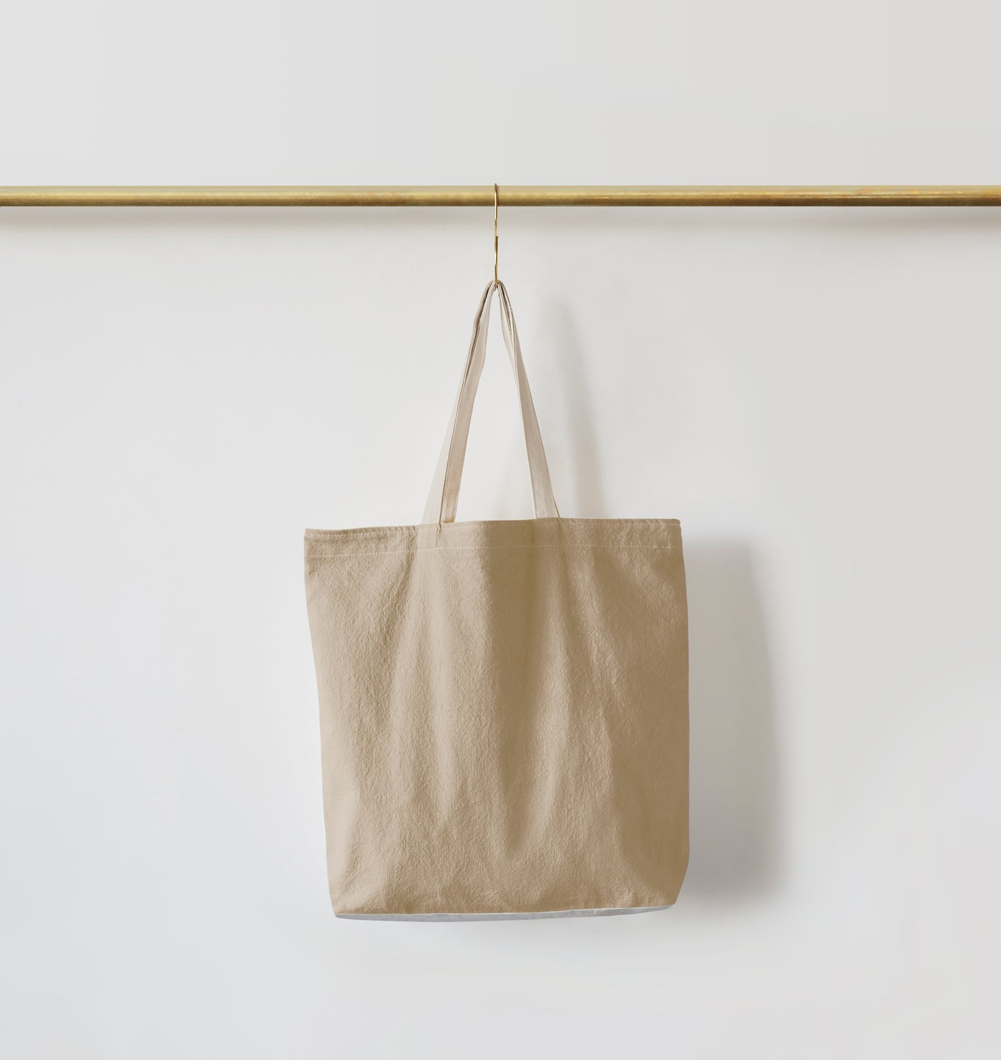 Re:Canvas Tote Hidden Beach front view hanging on rod