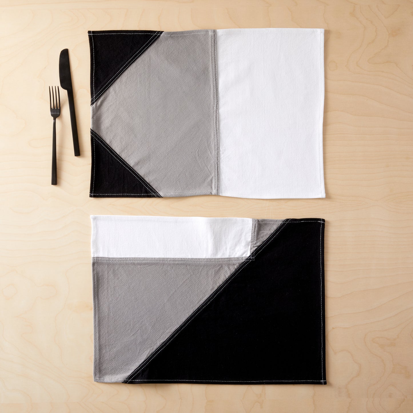 Narlai Night Ride Placemat flat on table with tableware