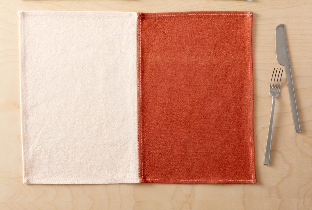 Lido Clay Placemat flat on table with tableware