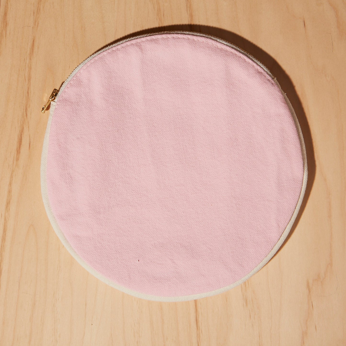 Re:Canvas "Threes" Pouch in Sunset front view of circle pouch