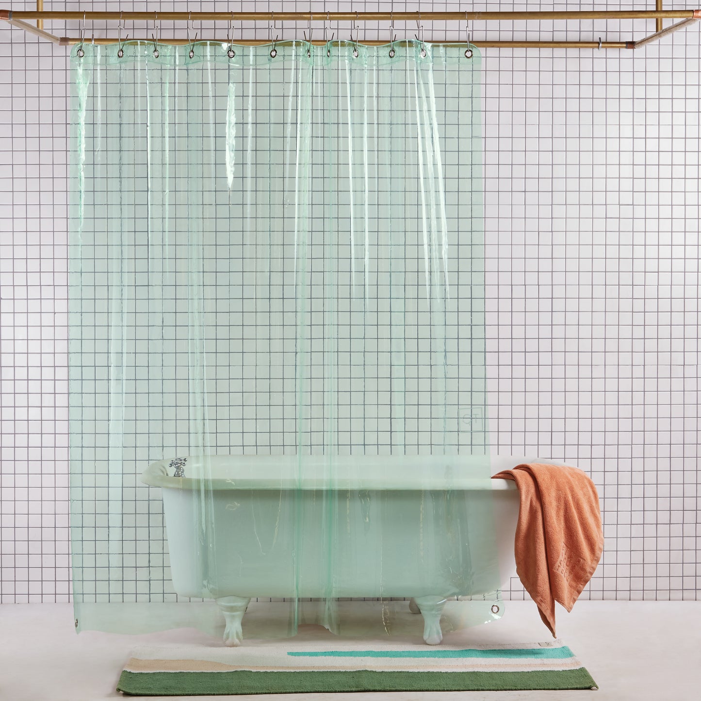 Sun Shower High front view of curtain hanging in a bathroom.