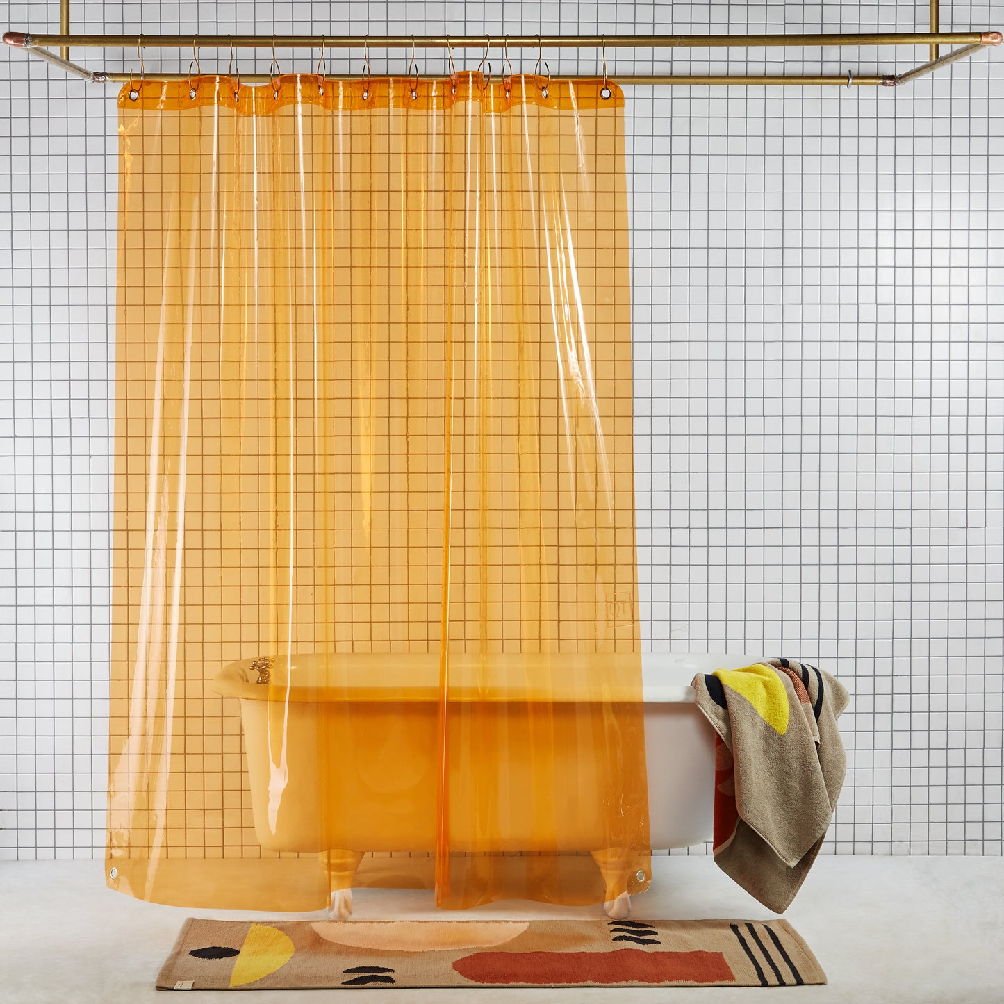 Sun Shower Juice front view of curtain hanging in a bathroom.