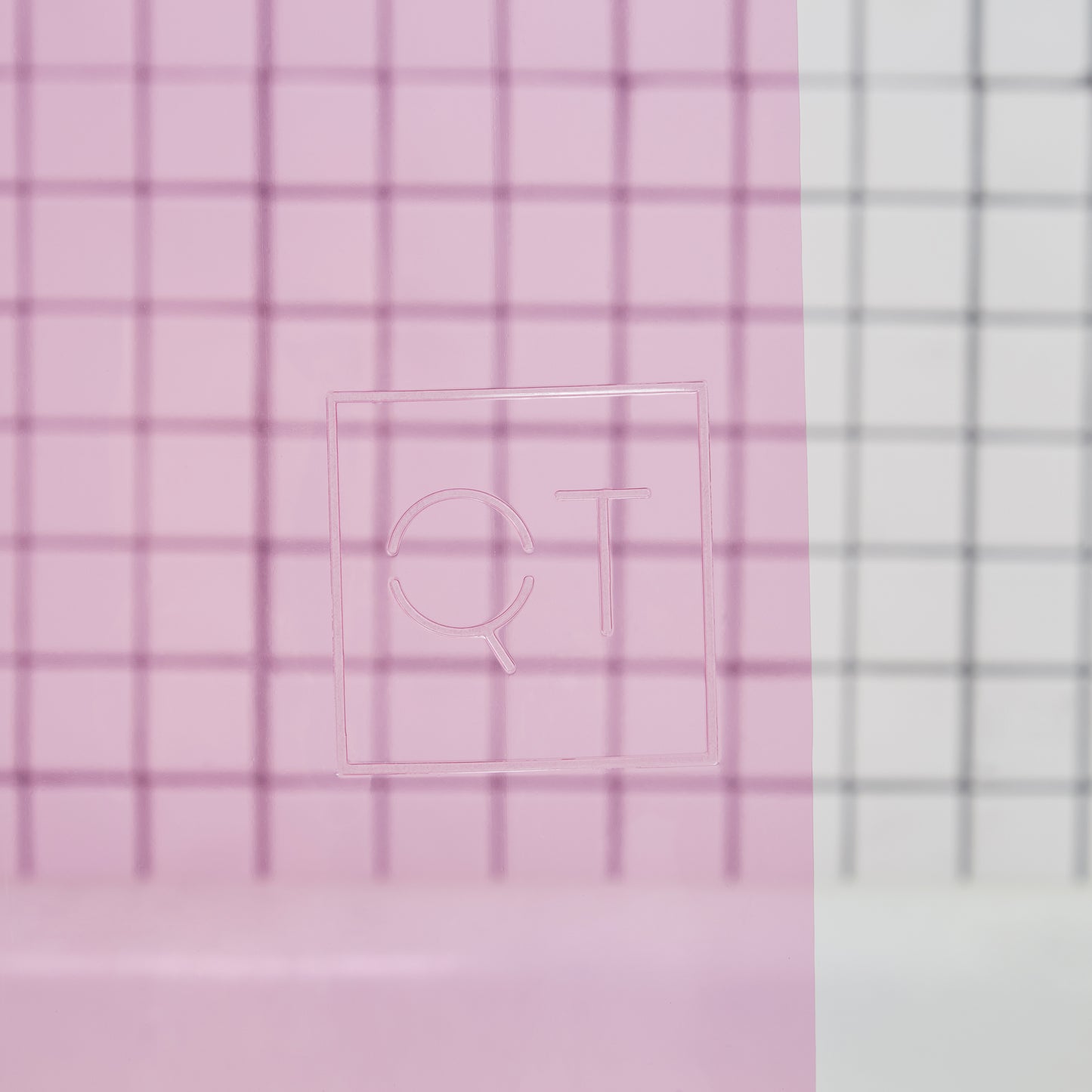 Sun Shower Phlox Detail view of the Quiet Town logo embossed on the shower curtain.