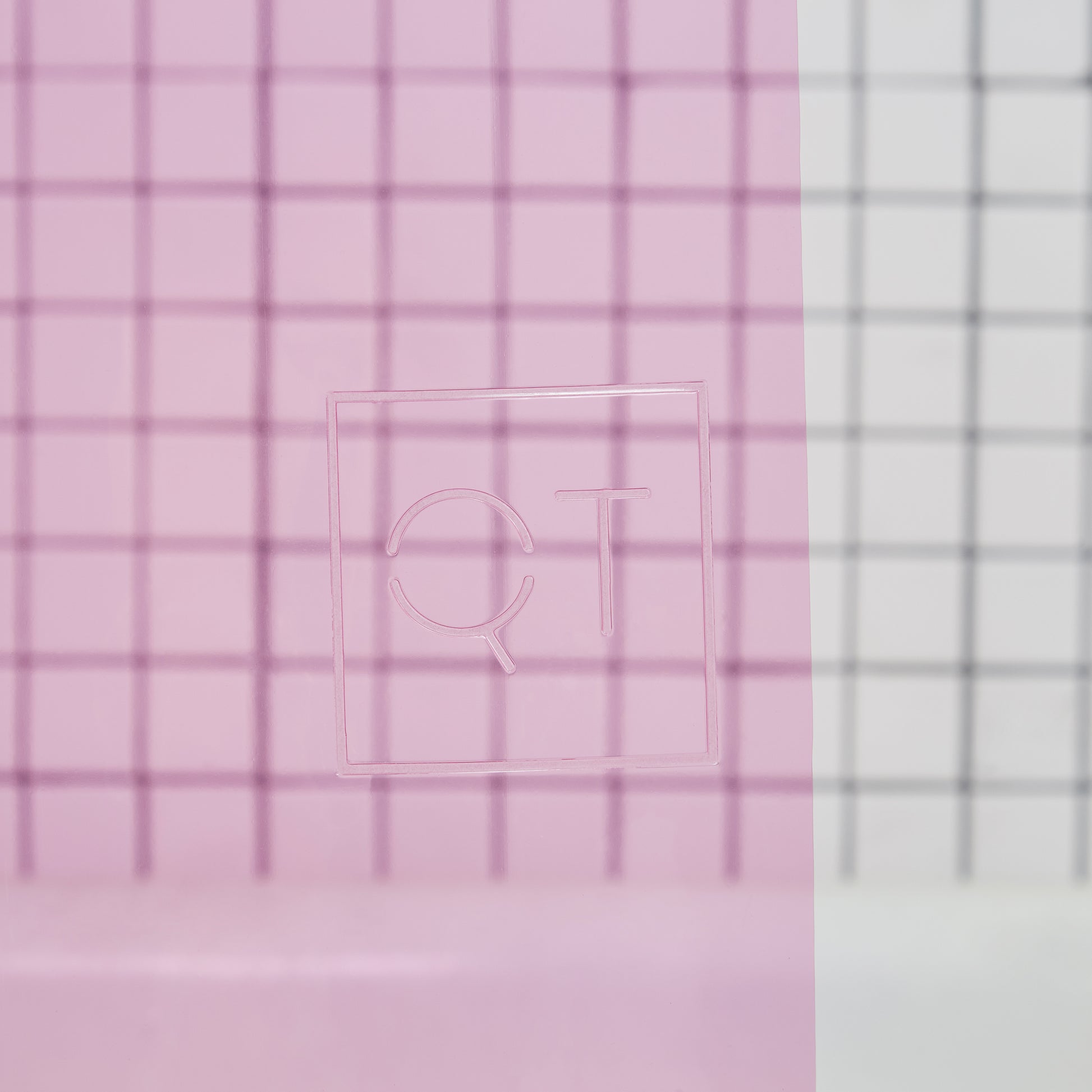 Sun Shower Phlox Detail view of the Quiet Town logo embossed on the shower curtain.