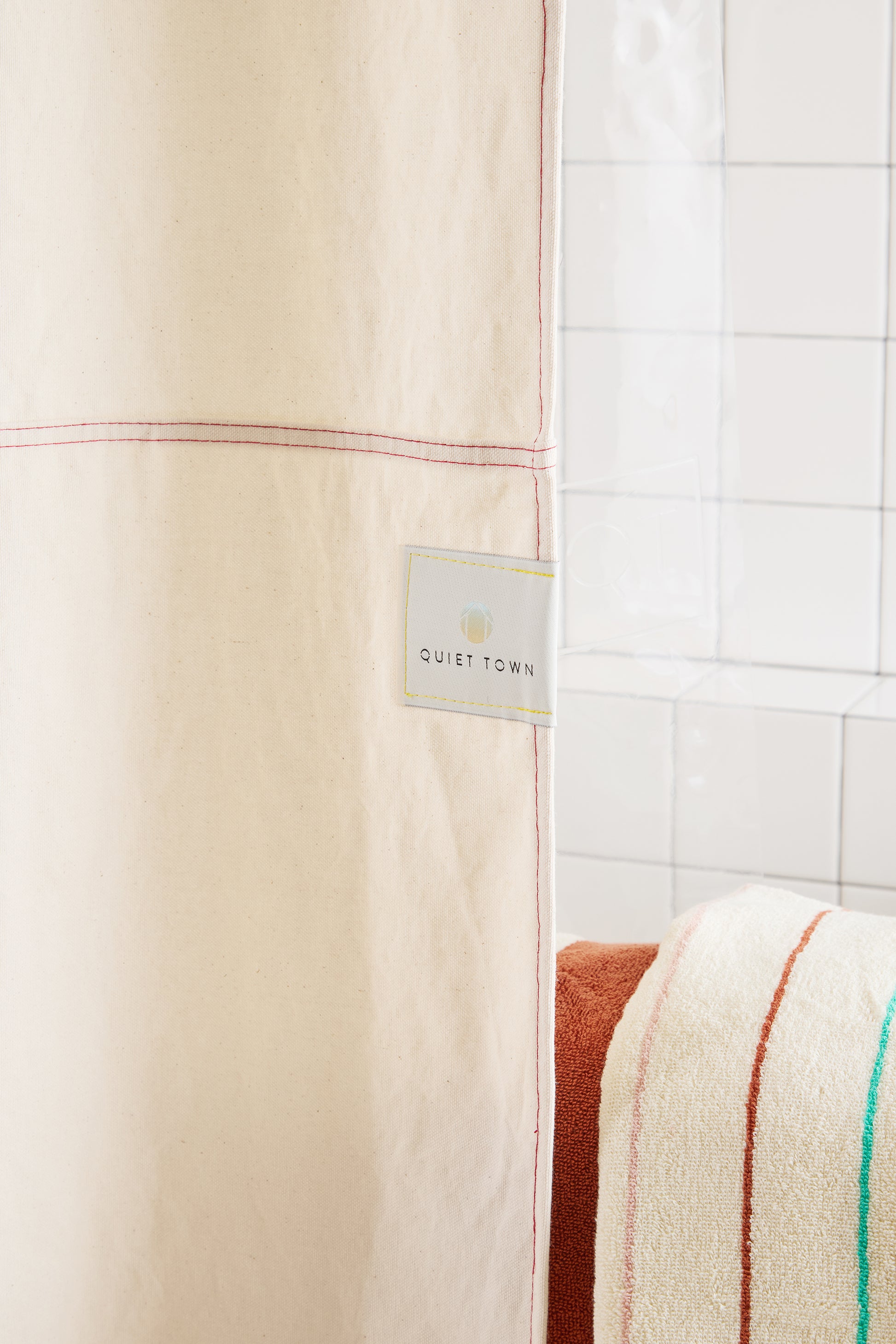 cream curtain with Quiet Town square label. 