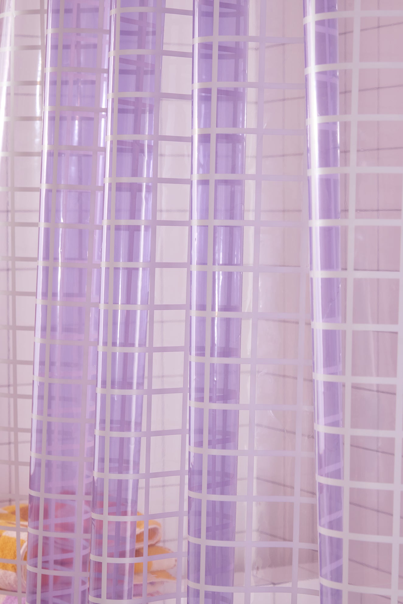 Sheer purple shower curtain with grid pattern