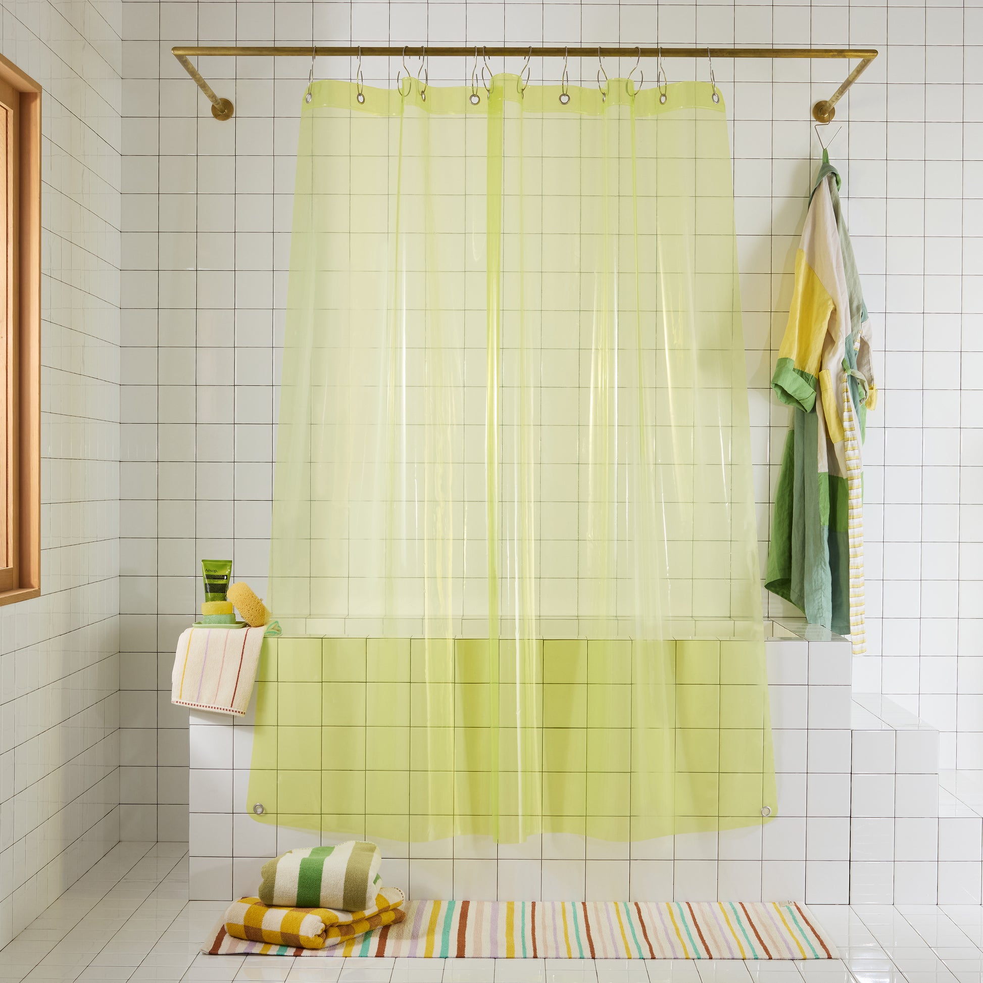 transparent neon yellow shower curtain hanging white bathroom