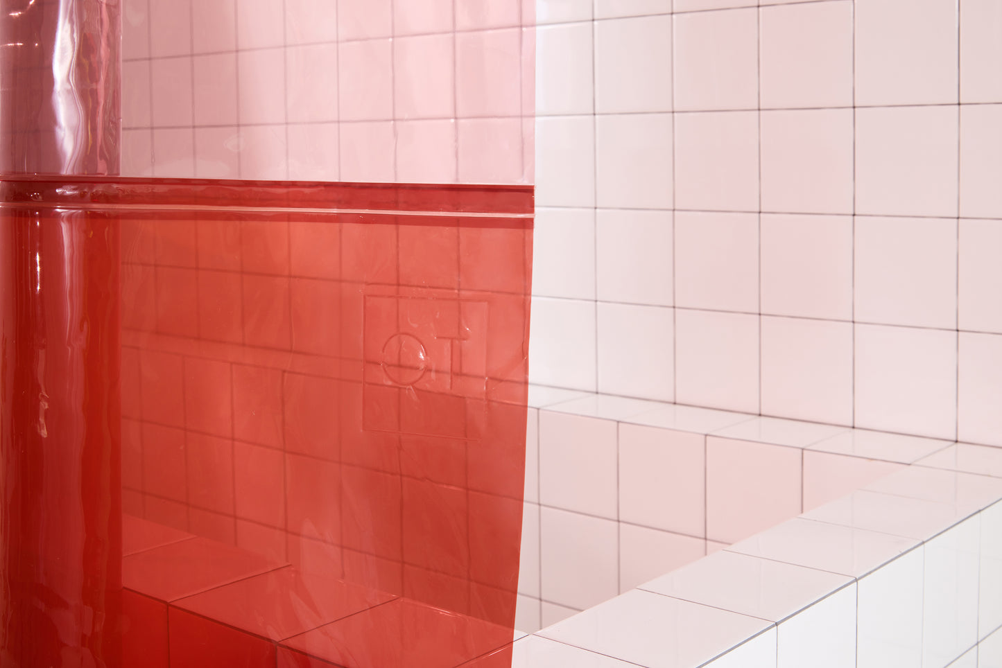 QT logo embossed on color blocked shower curtain. 