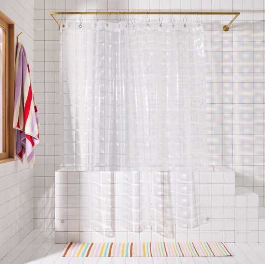 clear 3D curtain hanging in bathroom with white tile