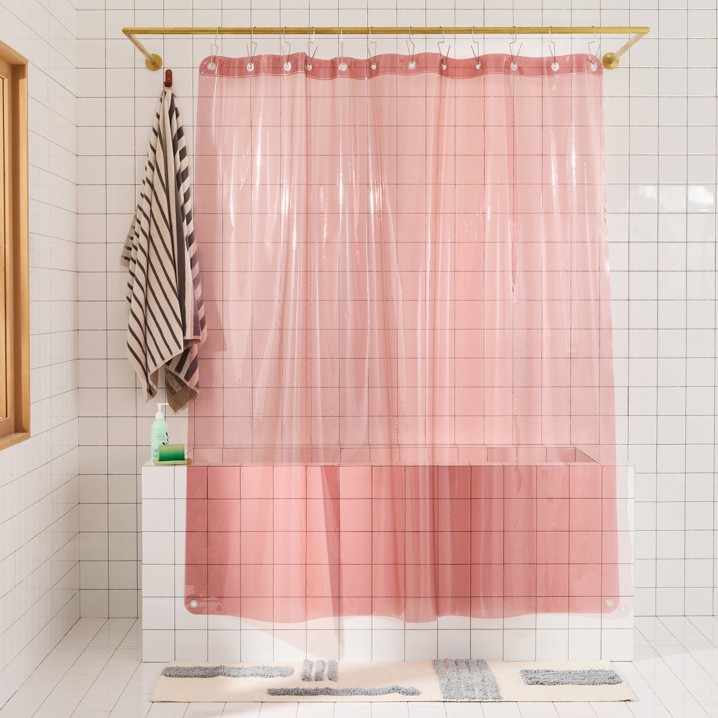 Sun Shower in Rose front view of curtain hanging in a bathroom.